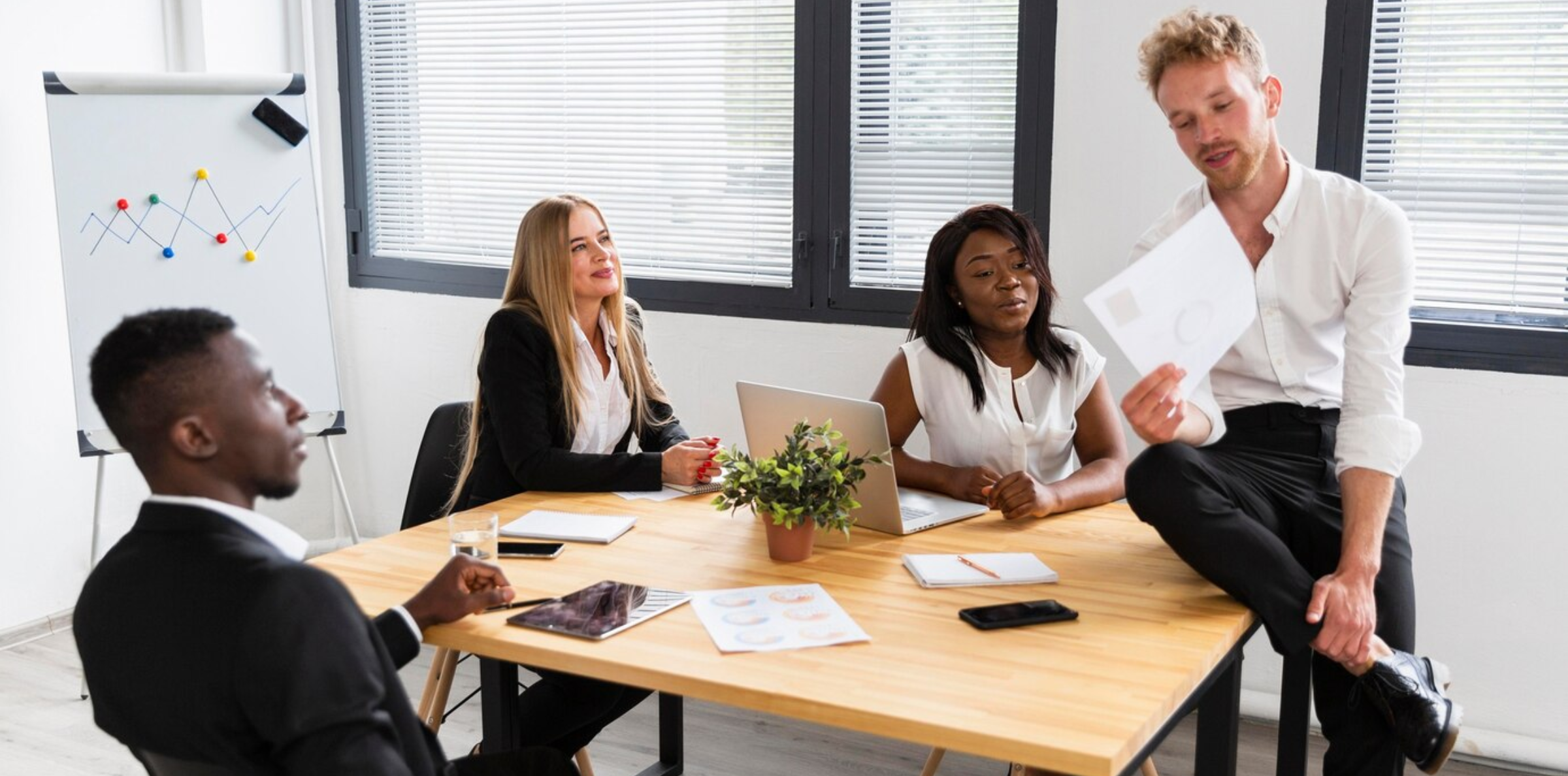 A leader reviews employee survey results, discussing actionable steps with the team to address and improve negative feedback. The focus is on fostering open communication and collaboration to resolve issues and enhance workplace morale.