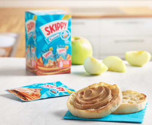 A slice of English muffin spread with creamy peanut butter, served as a quick and satisfying breakroom snack. This simple yet delicious snack provides a boost of energy and is perfect for those mid-morning or afternoon cravings.