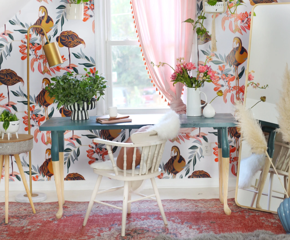 Budget home office furniture makeover: a teal painted desk with wood legs in a vibrant, boho-chic workspace