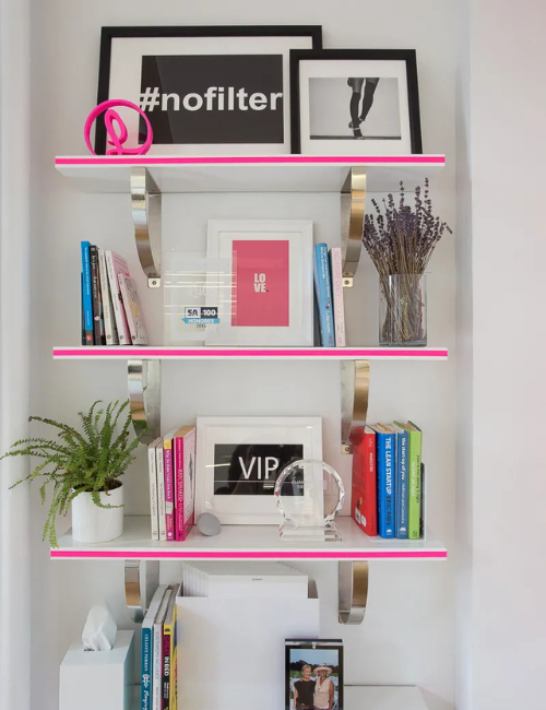 A fully immersive neon workspace with bold-colored shelves and playful accessories, creating an energizing environment.